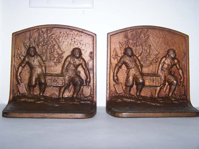 A pair of Antique Bookends by Hubley Mfg. circa 1925 depicting Pirates carrying a treasure chest